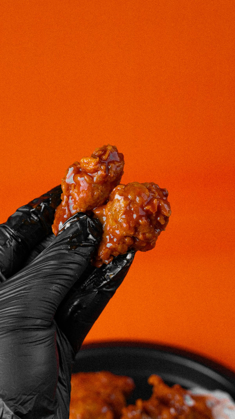 Cajun ranch dipping sauce with seasoned chicken wings