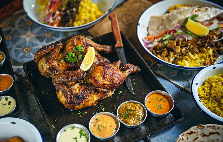 Grilled chicken with a selection of protein sauces and condiments