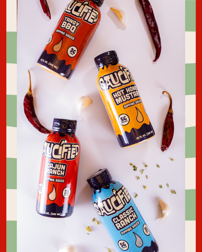 Four bottles of Saucified sauces surrounded by ingredients on a white background with red and green borders.