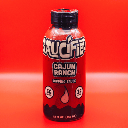 Saucified Cajun Ranch dipping sauce bottle on a red background