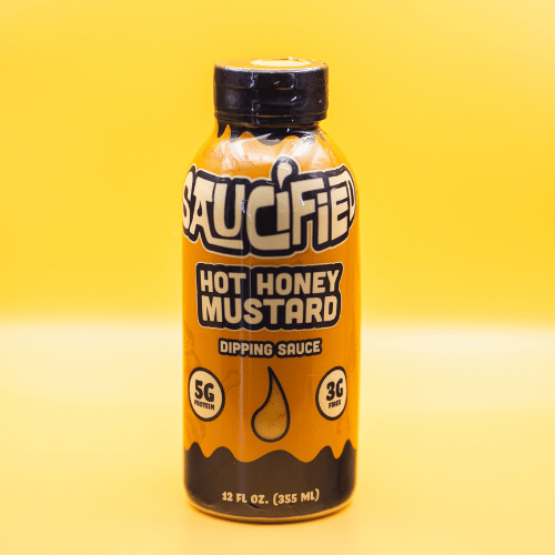 Saucified Hot Honey Mustard dipping sauce bottle on a yellow background